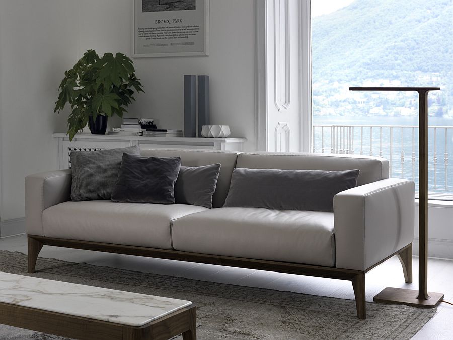 Slim floor lamp next to the sofa complements it perfecty