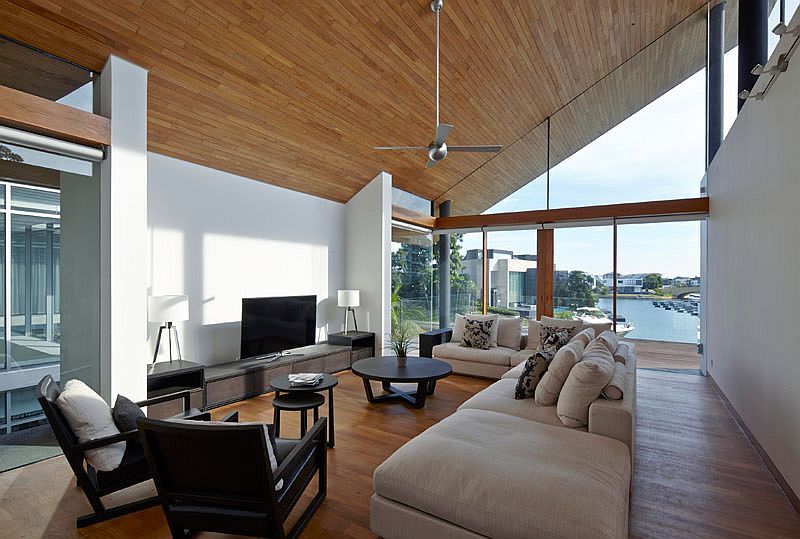 Sloped wooden ceiling adds a cool architectural twist to the interior