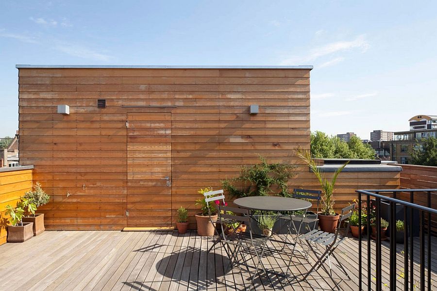 Small and stylish rooftop hangout helps the homeowners escape the urban rush