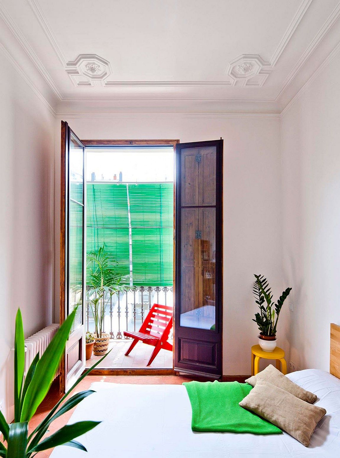 Small balcony connected with the modern bedroom of the Barcelona apartment