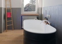 Small-bathroom-with-gray-half-walls-and-bathtub-in-black-217x155