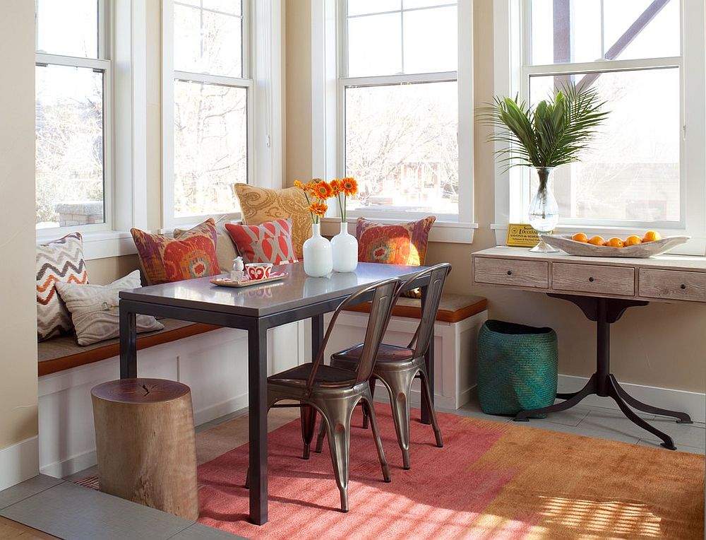 Small corner banquette with a cool bench and Marais A Chairs [Design: Ashley Campbell Interior Design]