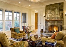 Stone fireplace and coffered ceiling create a cozy living room