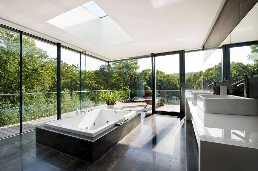 Stunning minimalist bathroom with framed glass walls