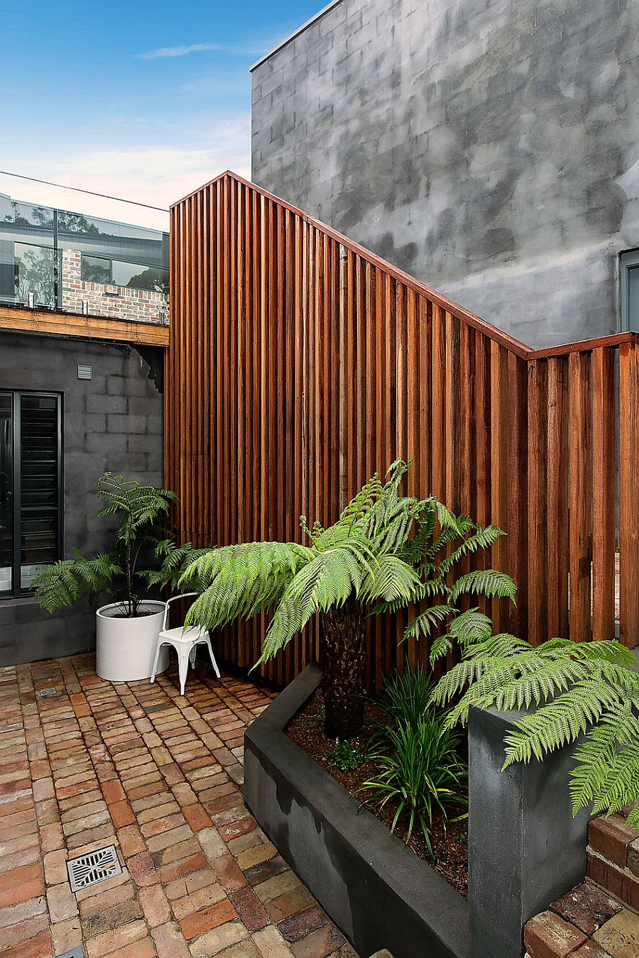 Stylish use of wooden slats combines privacy with textural beauty