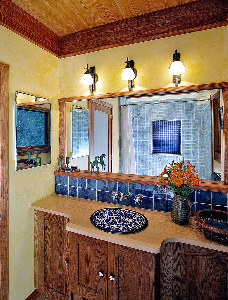 Textured walls in yellow bring warmth to the Mediterranean style bathroom [Design: Abrams Design Build / Photography: Ken Wyner Photography]