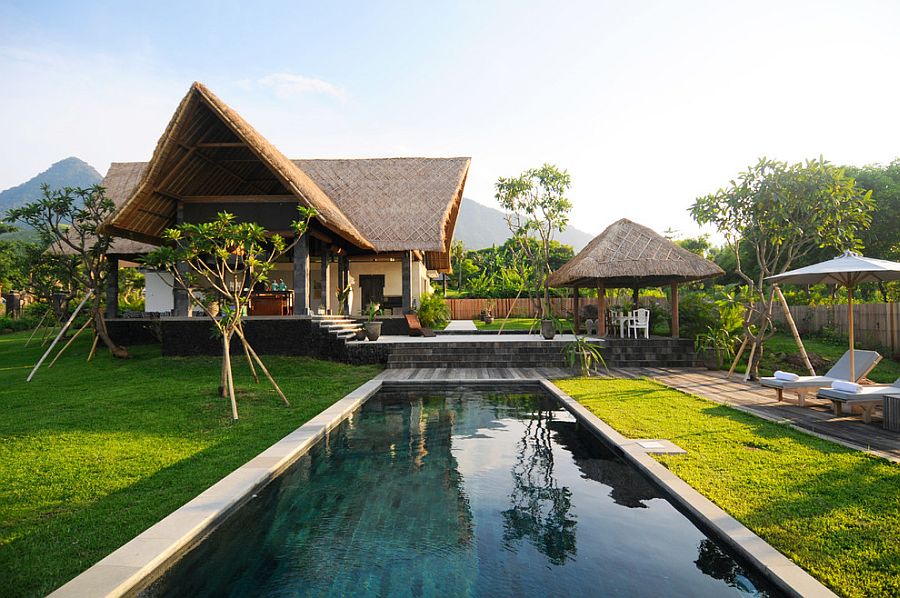 Thatched roof and poolside cabana bring an authentic tropical experience to LA home [Design: Addition Building & Design]