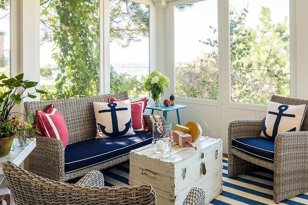 Throw pillows with nautical motif add to the elegance of the sunroom [Design: Hurlbutt Designs]