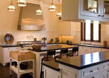 Traditional-kitchen-in-white-with-a-small-butcher-block-station-next-to-the-central-island-217x155