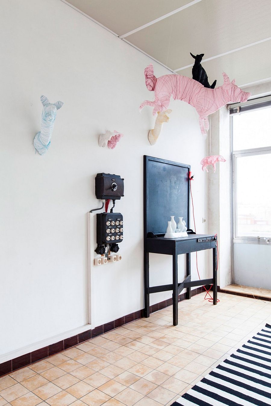 Unique, suspended animal figurines inside the Ghent apartment