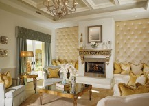 Upholstered walls in the comfy living room with golden charm