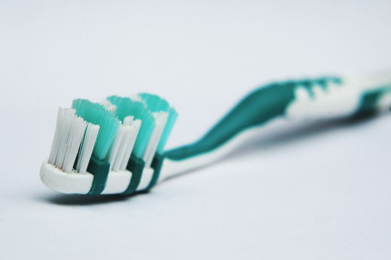 Use an old toothbrush to scrub away debris