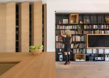Use-of-custom-wooden-boxes-adds-contrast-to-the-bookshelf-in-the-living-room-217x155