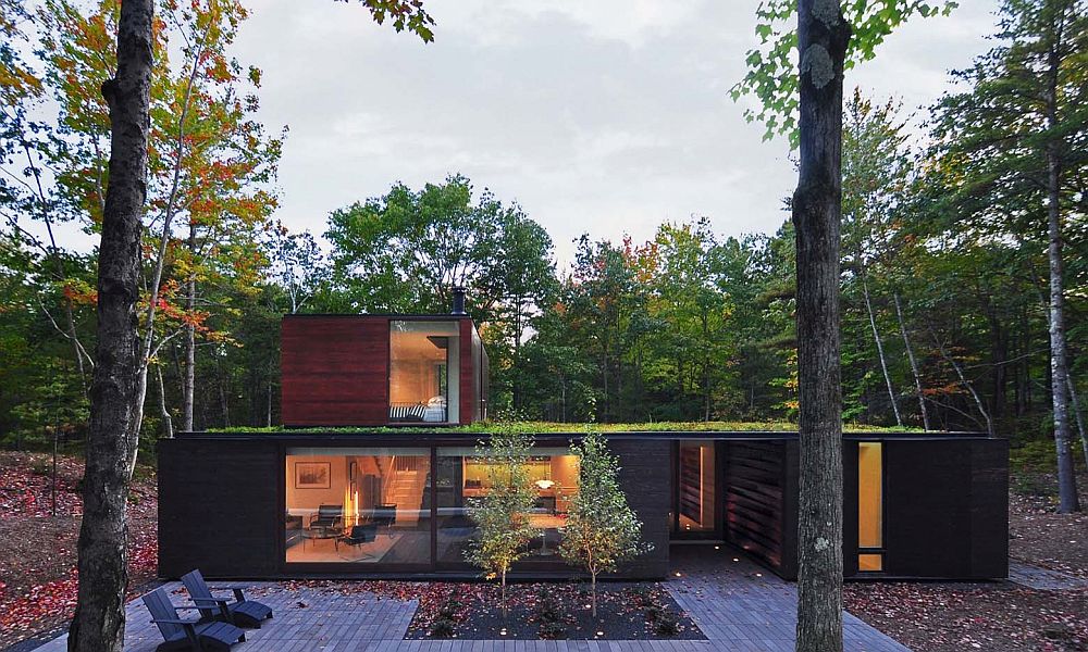 Vegetated roof and charred cedar siding shape the majority of the home's exterior