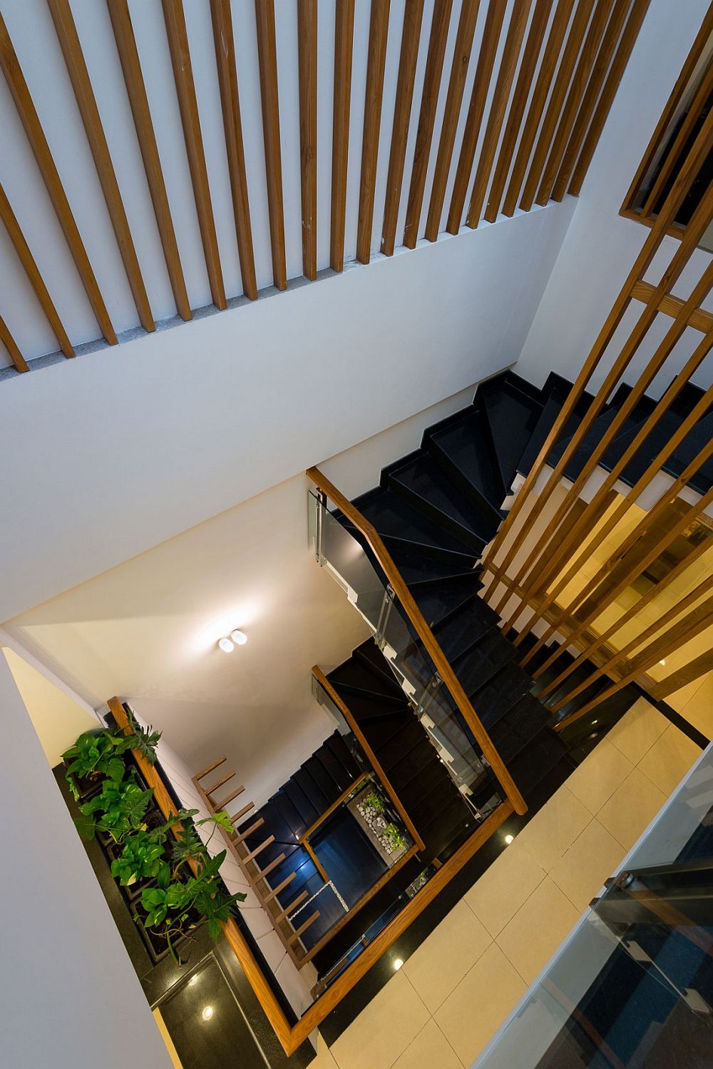 View of the light-filled stairwell from the fourth floor of the modern Ho Chi Minh city home