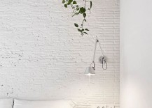 White-painted-ceiling-brick-walls-and-exposed-wooden-beams-of-the-Barcelona-home-217x155