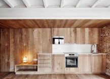Wooden-surfaces-in-the-kitchen-add-another-layer-of-textural-beuaty-to-the-small-tourist-apartment-in-Barcelona-217x155