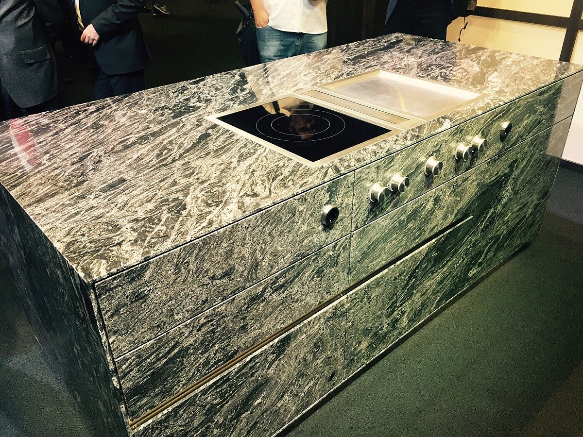 Awesome granite kitchen island with cooktop and workstation from Strasser