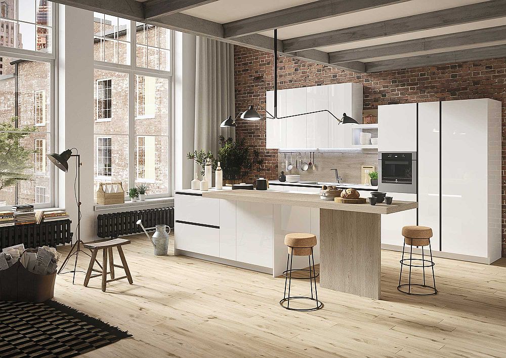 Brick wall in the backdrop adds textural beauty to the minimal kitchen