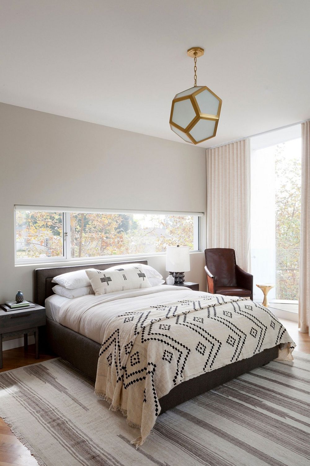 Elegant modern bedroom in white with ample natural light