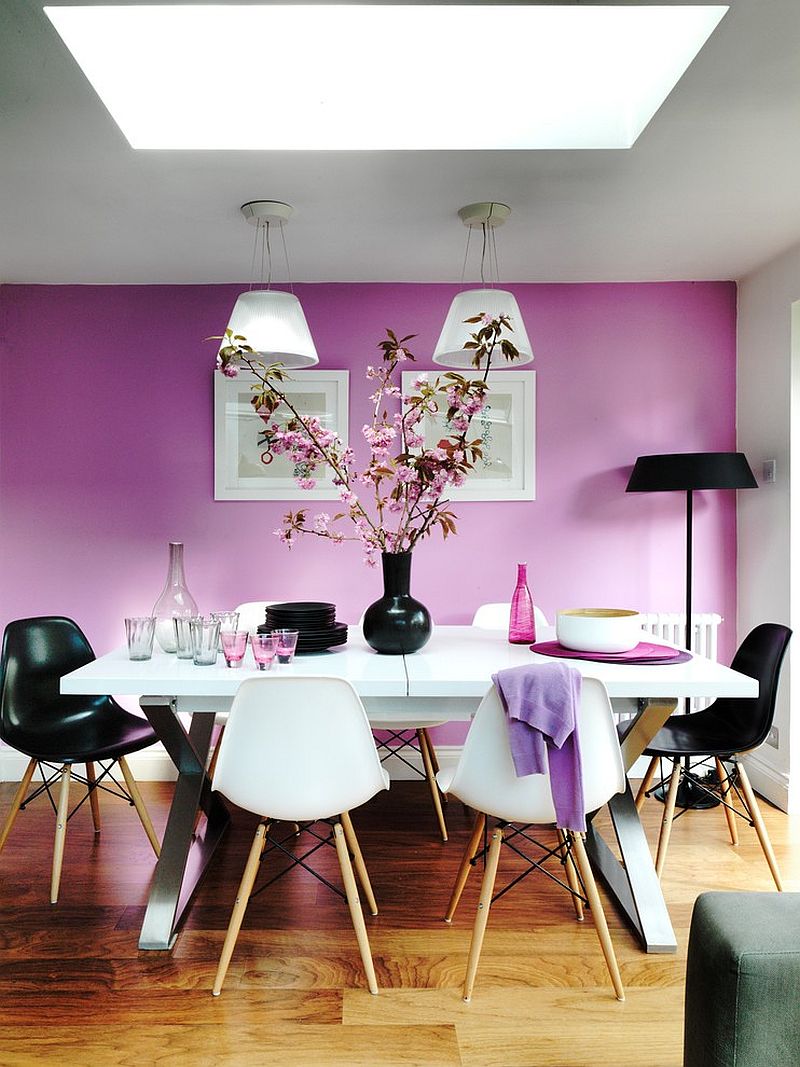 Exquisite dining room with purple walls offers a stunning backdrop for the Romeo Moon pendants [Design: Juliette Byrne]