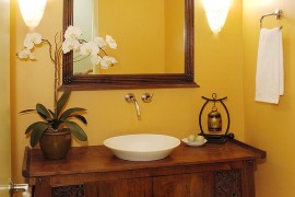 Fabulous, cutom-crafted vanity for the warm, tropical powder room
