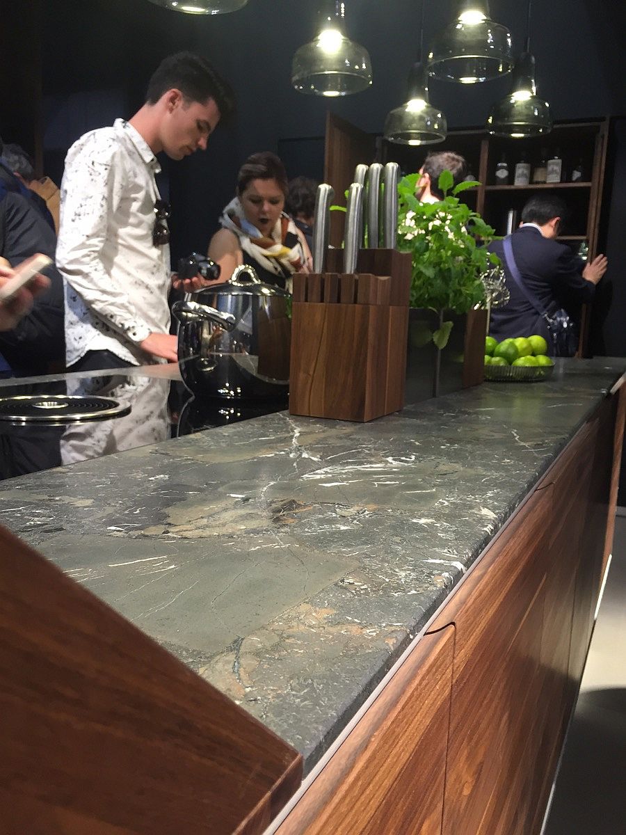 Fabulous kitchen island with stone worktop and wooden shelves - Team7 at EuroCucina