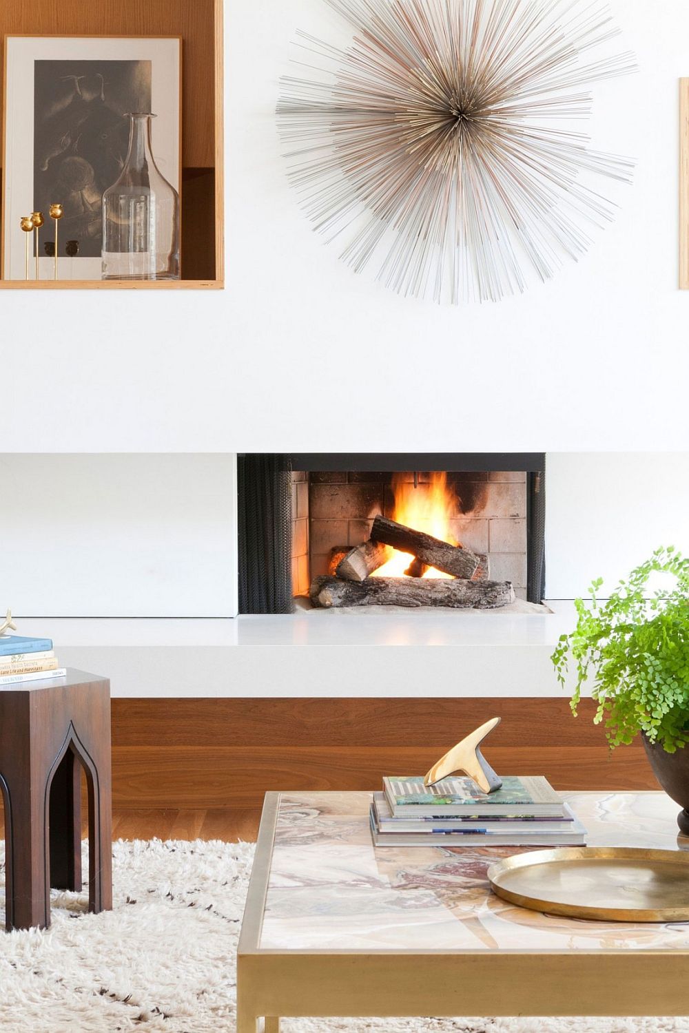 Fireplace inside the living room adds a cozy, contemporary focal point