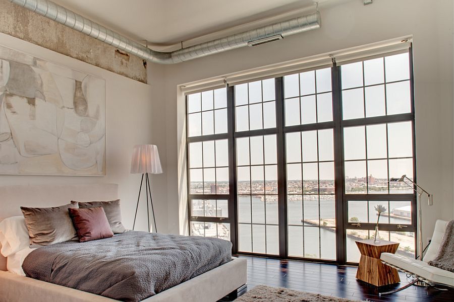 Industrial bedroom with the striking Rosy Angelis floor lamp [Design: Turner Development Group]