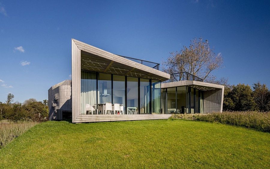 Large glass walls offer unabated views from the living area of the polder landscape