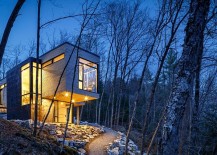 Light-adds-inviting-warmth-and-sparkle-to-the-cottage-in-woods-217x155