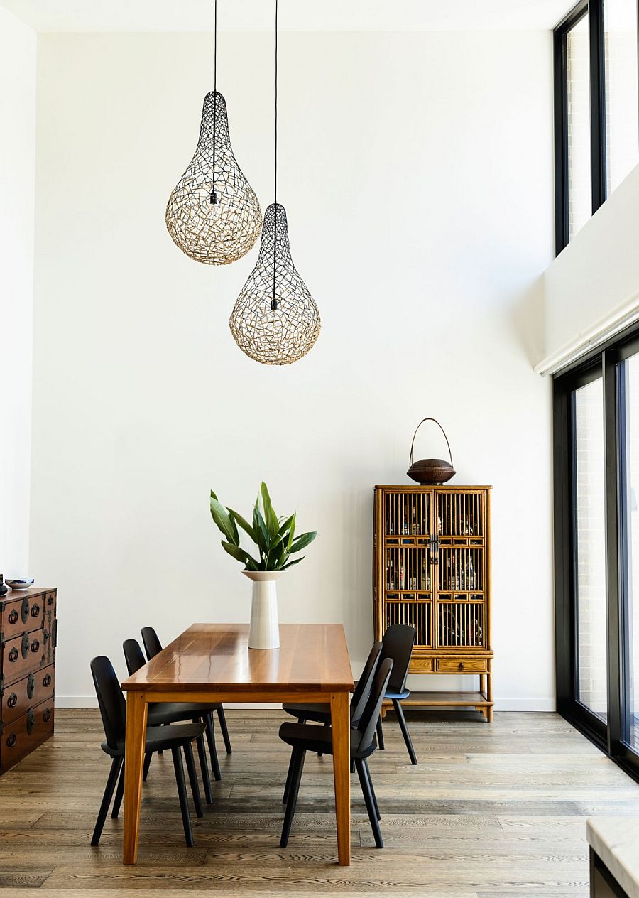 Lighting fixtures add a fun twist to the modern dining space
