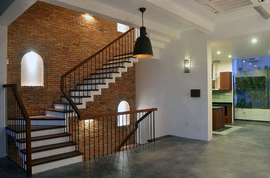 Lovely little windows in the brick wall usher in natural light