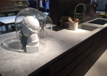 Marble-countertop-offers-visual-contrast-to-the-dark-wooden-counters-of-the-island-217x155