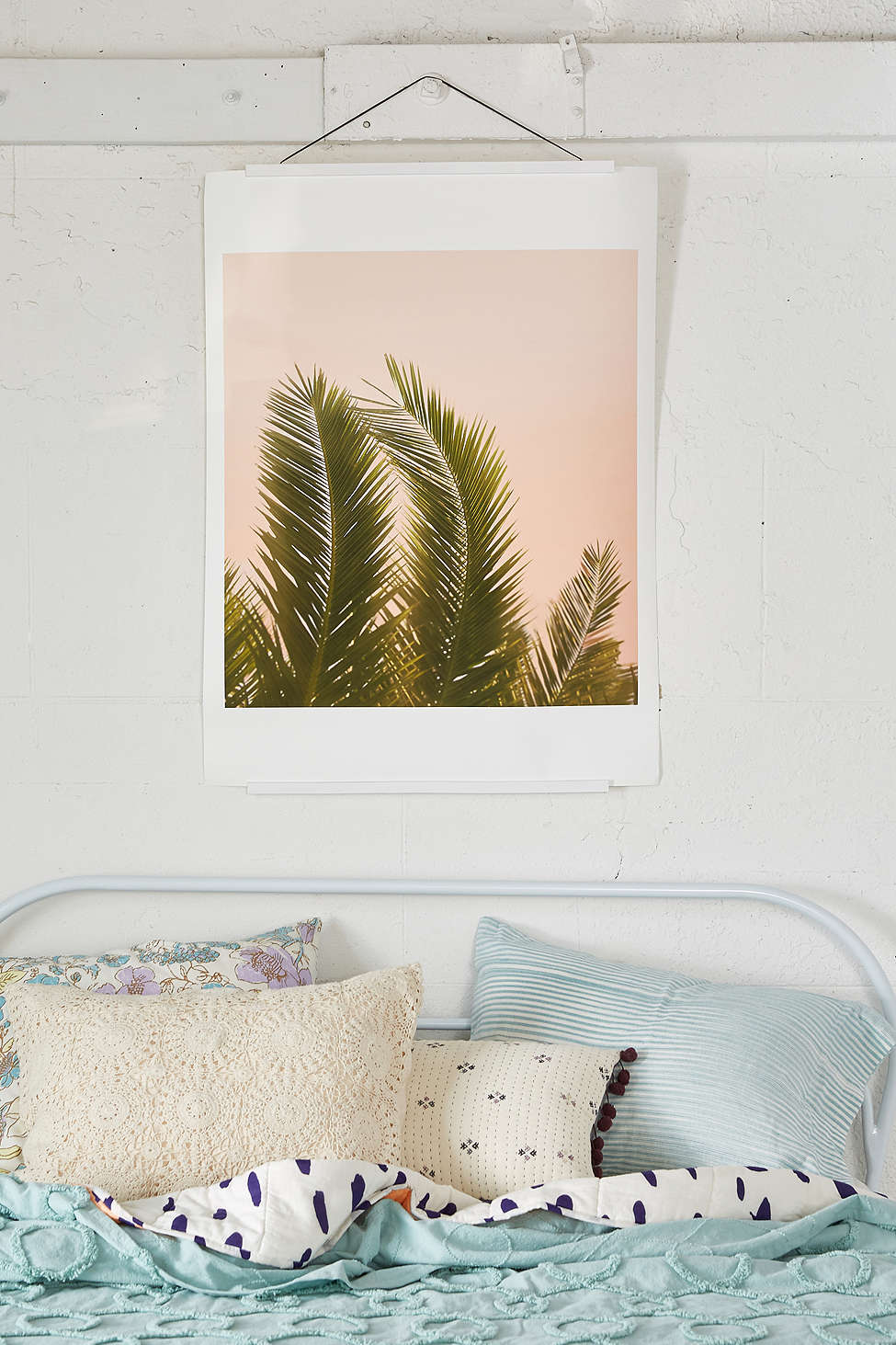 Palm tree art in a bedroom by Urban Outfitters