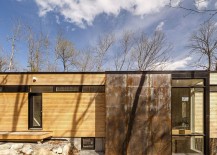Raw-steel-elements-coupled-with-soft-wooden-finishes-give-the-exterior-of-the-cottage-a-unique-look-217x155