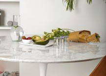Tulip-table-with-marble-top-inside-the-chic-Milan-apartment-217x155