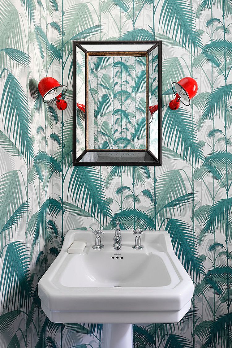 Wall sconces add a pop of red to the delightful powder room [Design: Turner Pocock]