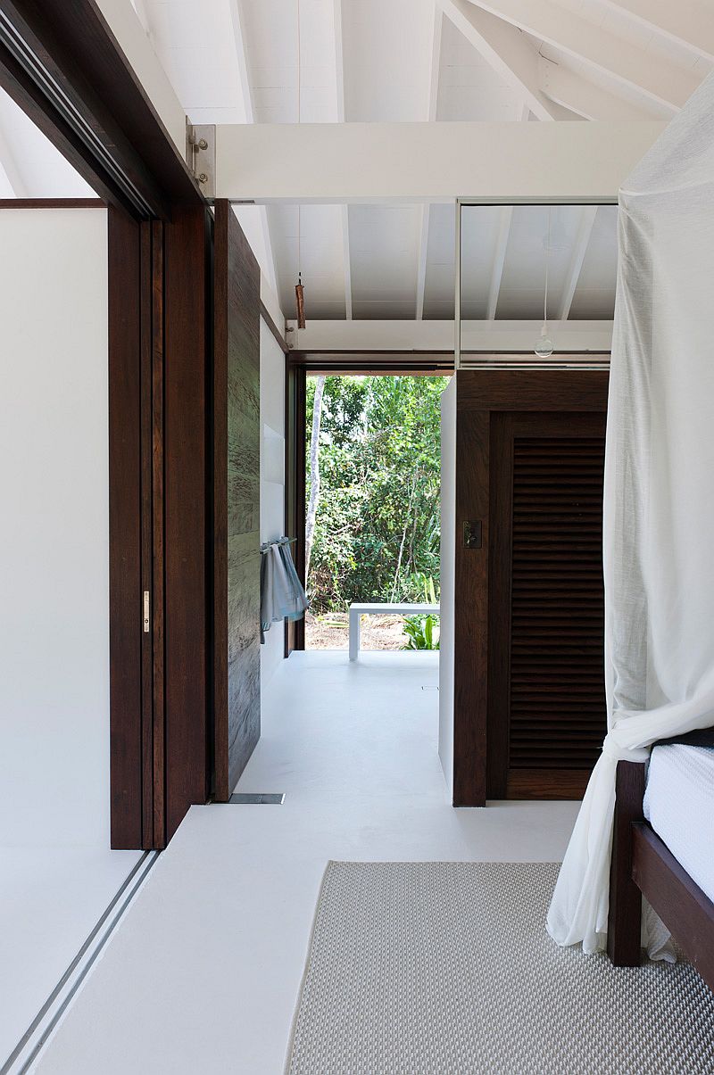 White coupled with dark wooden surfaces inside the beach house