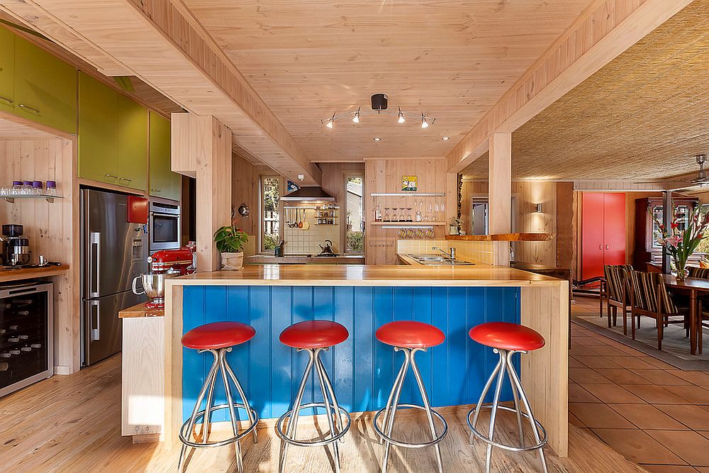 Beautiful beach style kitchen with pops of blue, red and green