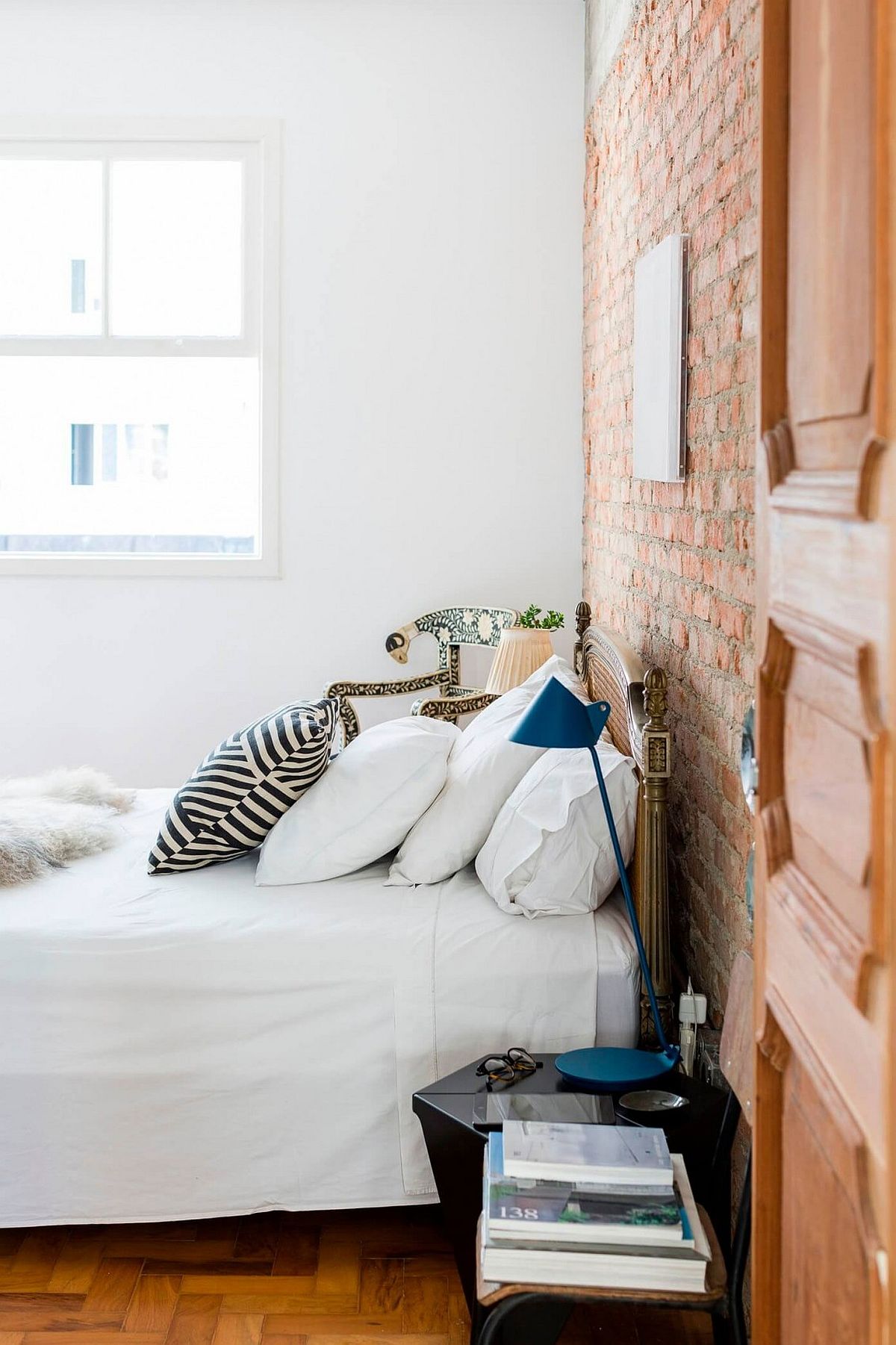 Bedroom inside cheerful Sao Pauloe home with brick accent wall