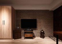Brick-accent-wall-section-delineates-the-TV-zone-form-the-rest-of-the-interior-217x155