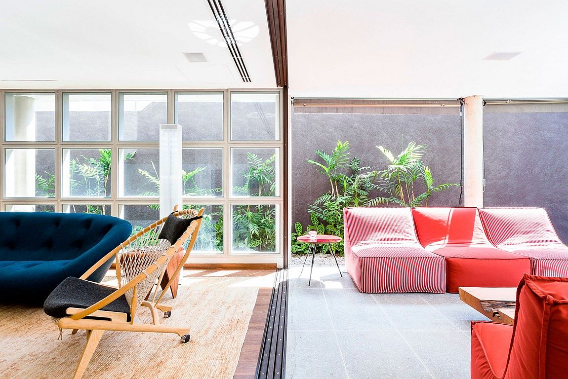 Bright and colorful furniture bring the interior of the Brazilian home alive