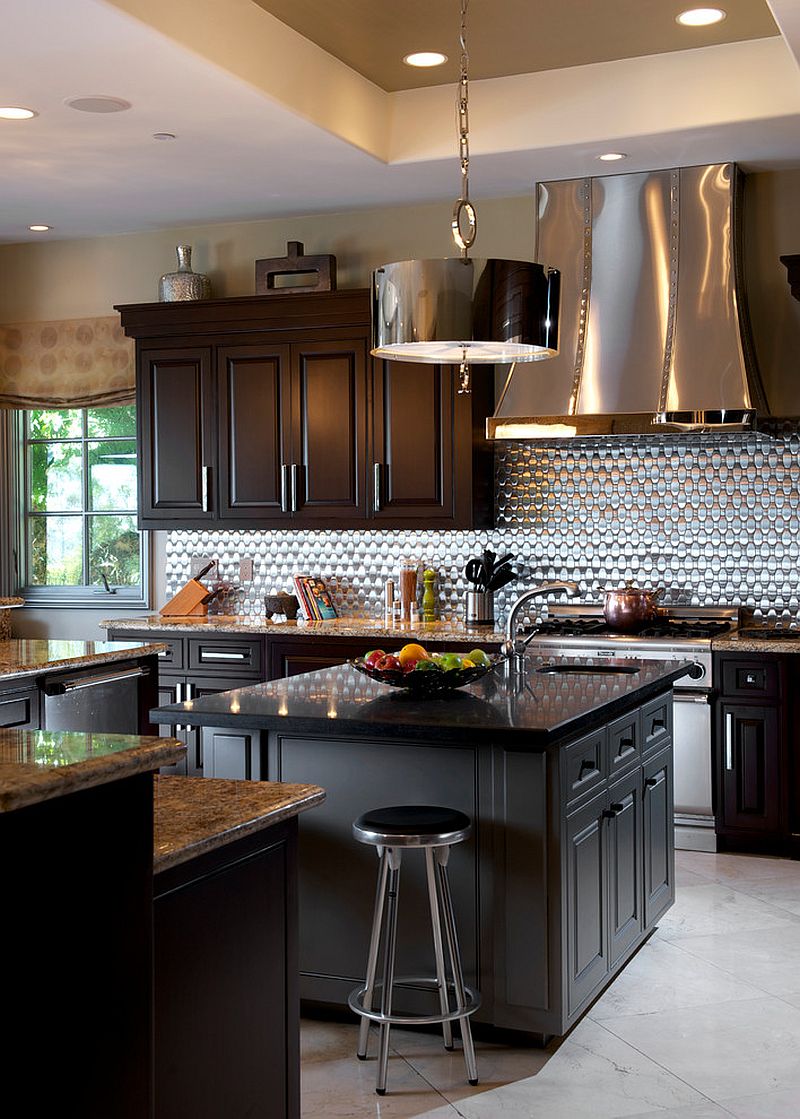 Bright metallic backsplash and hood draw your attention instantly [Design: Dora Brigham Interiors]