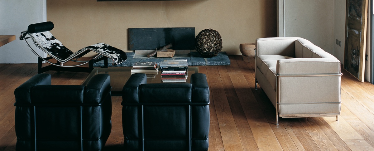 Cassina was formed in 1927 by brothers Cesare and Umberto Cassina. In 1964, Cassina acquired the rights to produce designs by Le Corbusier, Pierre Jeanneret and Charlotte Perriand: the LC Collection. This image shows the LC2 armchair and sofa with the LC4 Chaise longue. Designed in 1928 by Le Corbusier, Pierre Jeanneret and Charlotte Perriand. Image © Cassina.