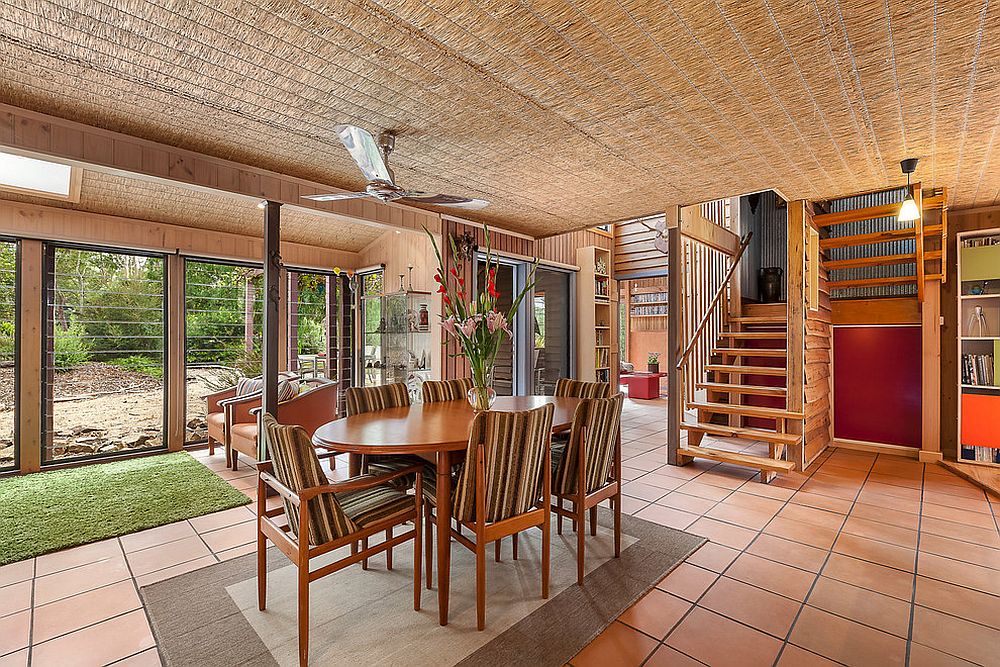 Ceiling of the dining room keeps it natural cool inside the beach style Aussie Residence