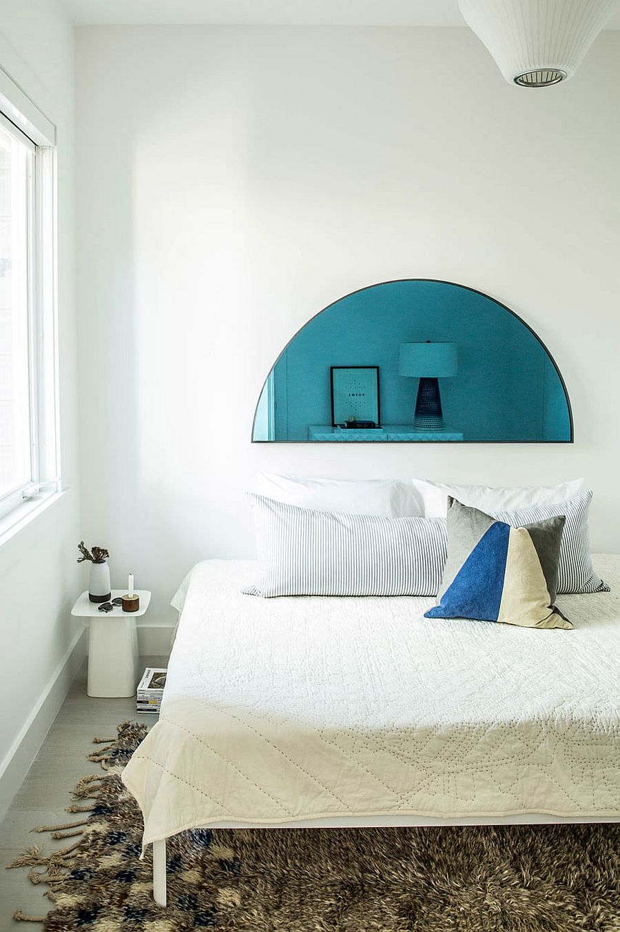 Contemporary bedroom in white with a hint of blue