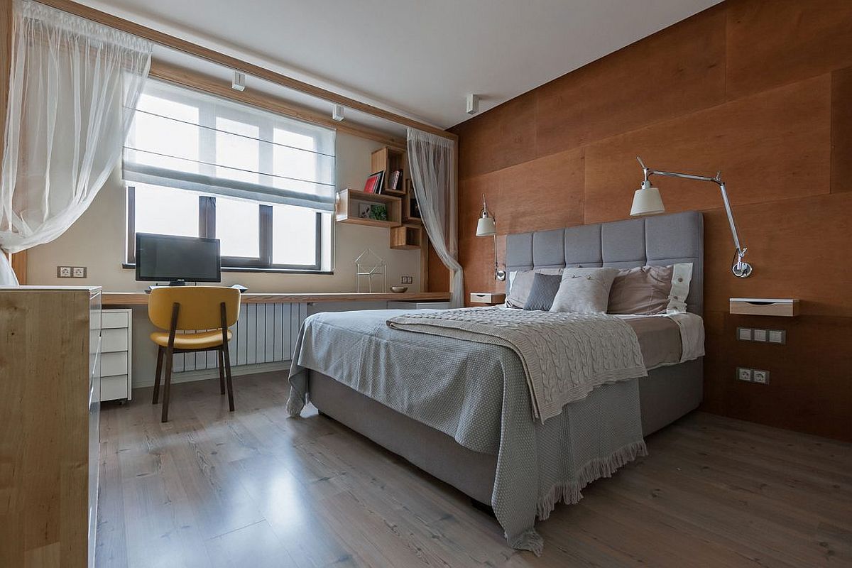 Contemporary bedroom with wooden accent headboard wall