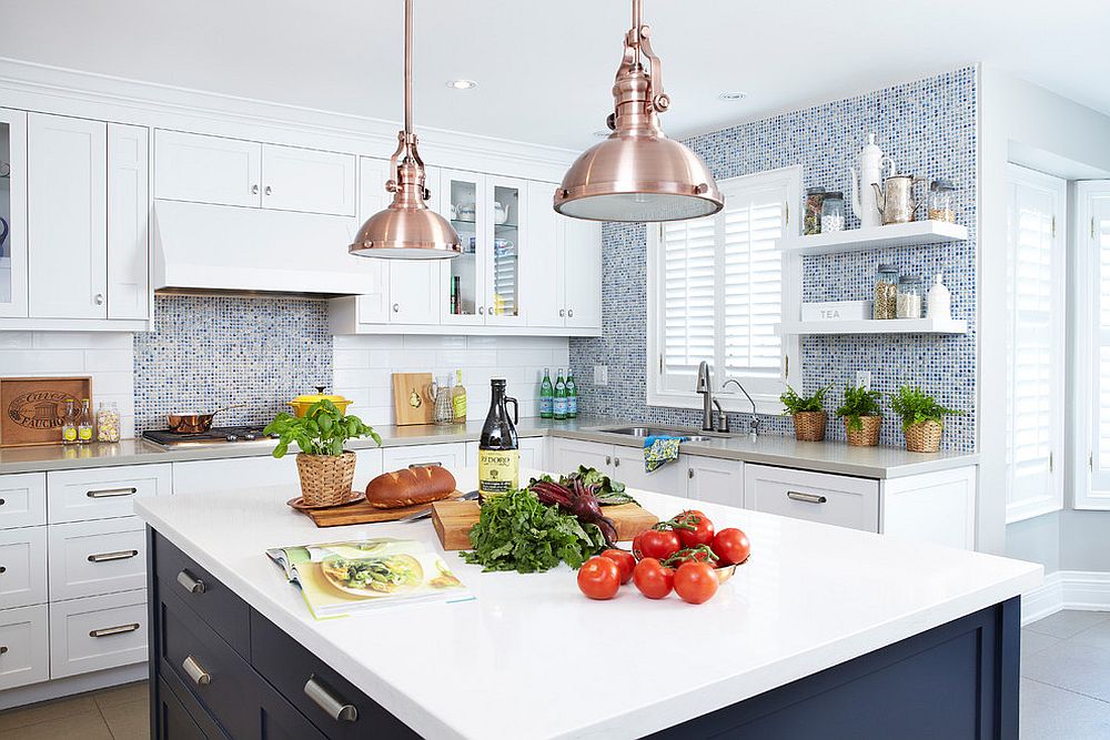 Copper pendants add glitter to the kitchen in white and navy blue [Design: Sealy Design]