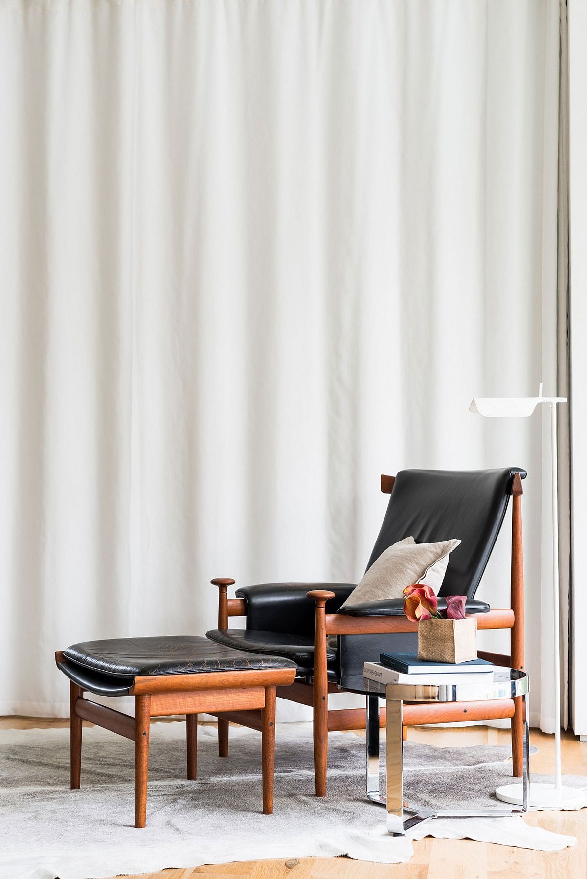 Craft a classy reading nook with confortable lounger and a simple side table